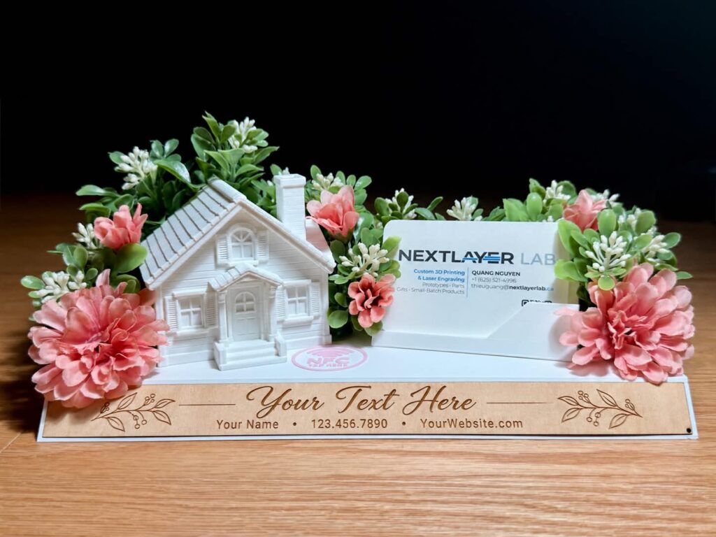 Personalized 3D-printed house display with floral decor, business card holder and engraved wooden nameplate